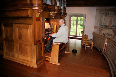 Herr Hofer plays the church organ