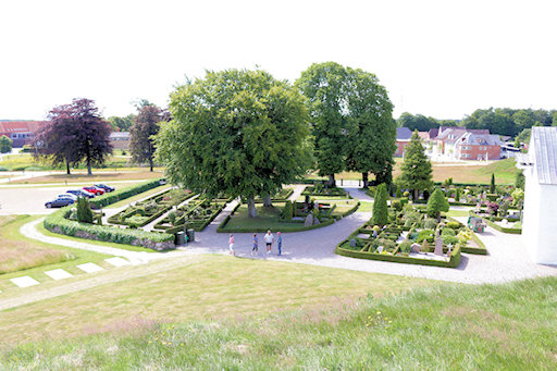 Graveyard next to the church with the museum building in the background&copy;Ken Woolfenden