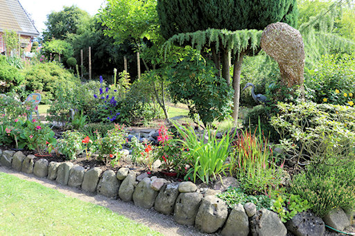Flowerbed in front of the pond&copy;Ken Woolfenden