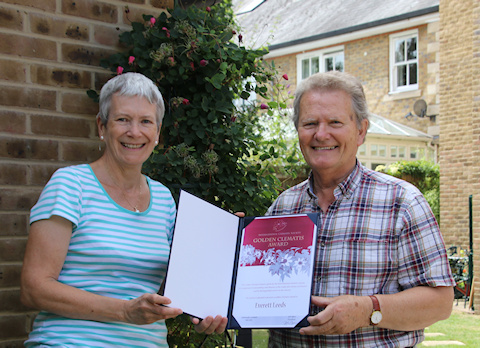 Everett Leeds receiving his Golden Clematis Award from Fiona Woolfenden