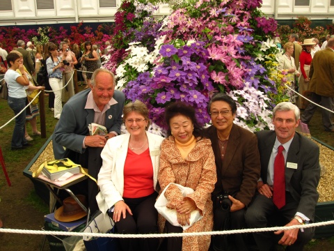 Left to right Charles Welch, Ruth Gooch, Kuniko Atarashi, Kinju Atarashi and Jon Gooch at Chelsea Flower Show 2010 with Clematis 'Kinju Atarashi' immediately behind Kuniko Atarashi©Tolver Gooch Ltd.